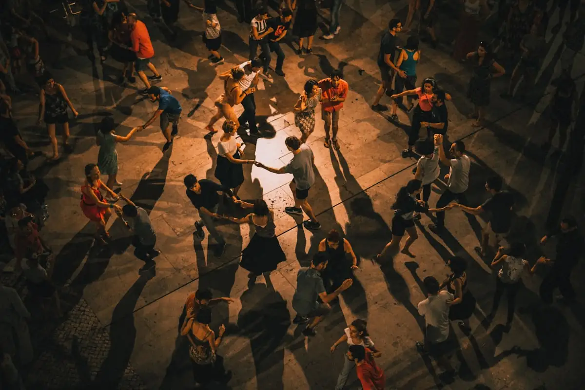 Dance group practicing choreography in a studio
