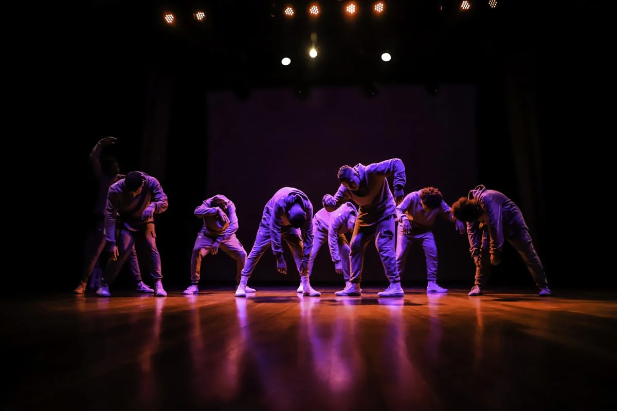 Dance troupe performing on a stage